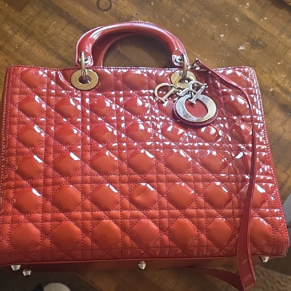 Christian Dior Large Lady Dior bag in red patent leather with silver hardware.